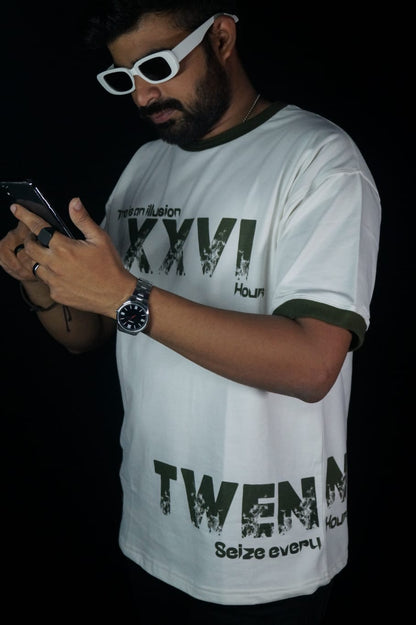 Model showcasing side view of Twennysix XXVI Cotton T-shirt with chic dark green neckline and sleeve ribs.