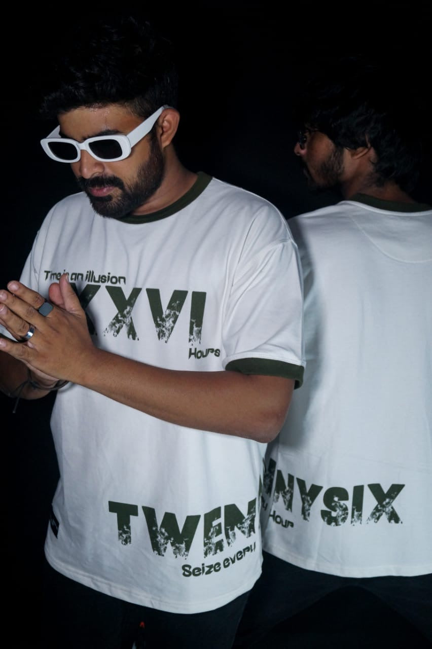 Two models demonstrating the synchronization between the front and back sides of the Twennysix XXVI Cotton T-shirt.