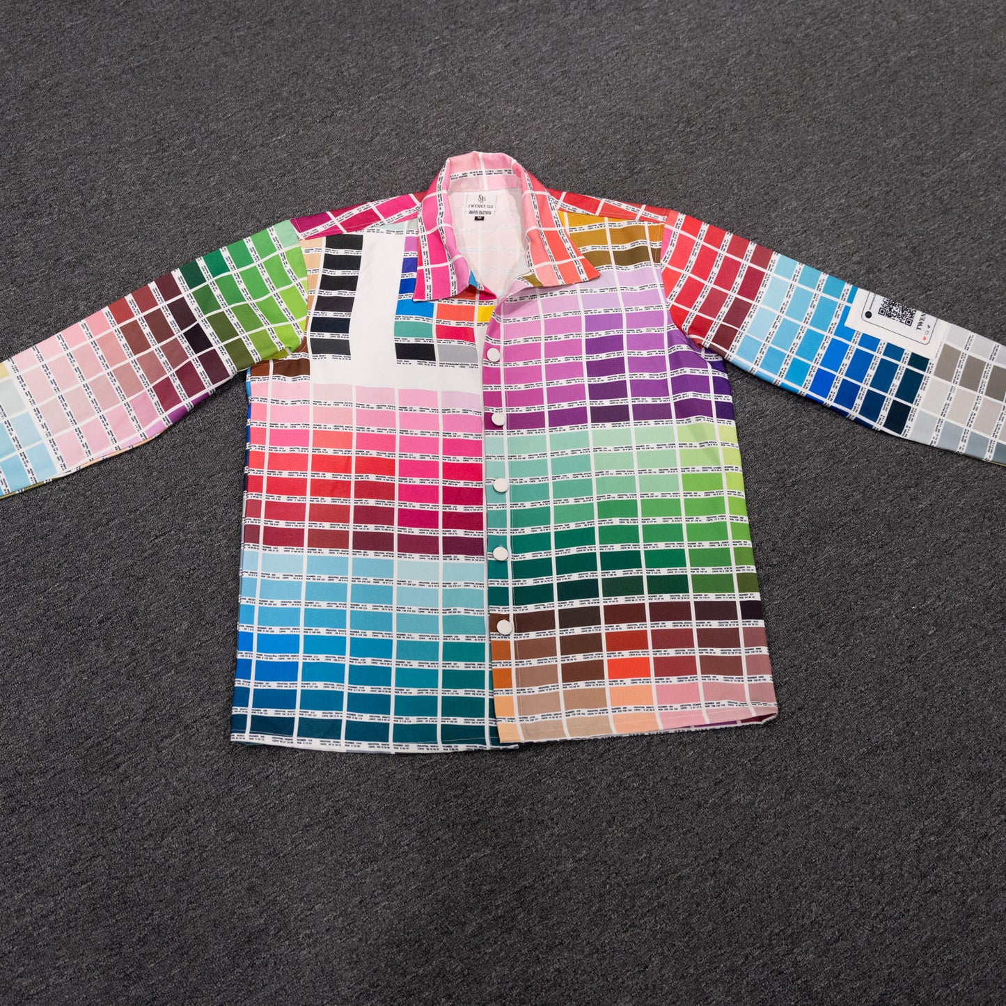 Flat lay view of the vibrant palette print jacket, showcasing the complete design and intricate details.