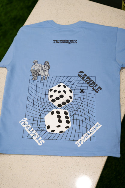 Close-up image of the backside graphic on the Twennysix Dicey T-shirt, featuring an intriguing design symbolizing life's nature.