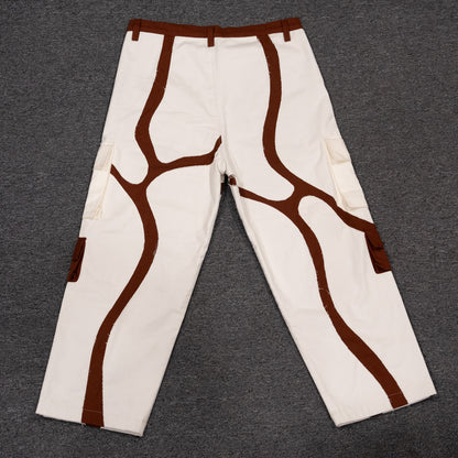 Back view of the MochaBlend Cargo Pant, showcasing its sturdy brown base and integrated white pant for versatile style.