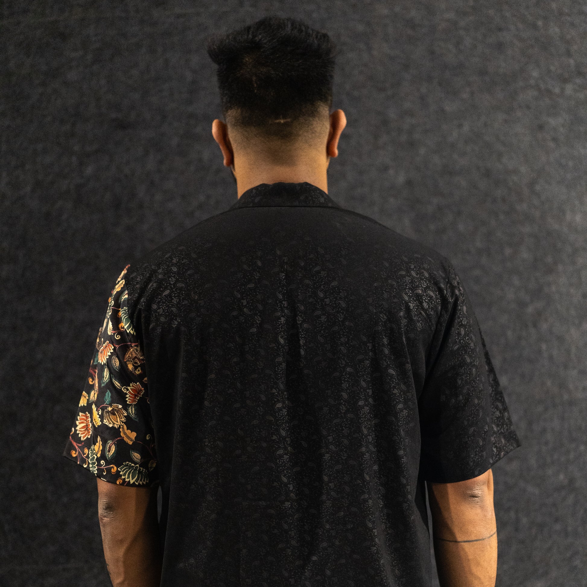 Model wearing Twennysix Kalamkari Fusion Shirt, showcasing the back side with Twennysix branding and intricate Kalamkari prints for a stylish and distinctive look.