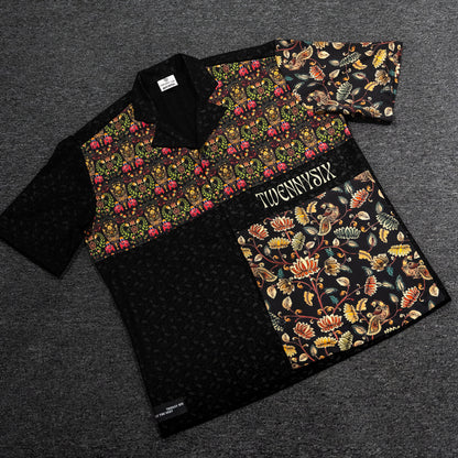 Flat lay showcasing Twennysix Kalamkari Fusion Shirt: Intricate Kalamkari prints, oversized elephant motif, half sleeves, and unique fusion design on black cotton fabric