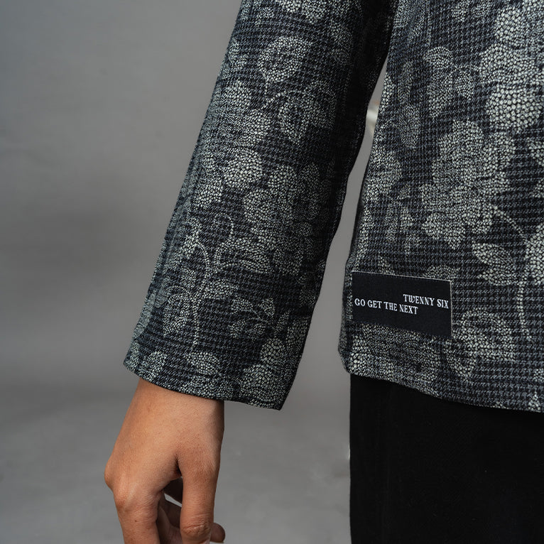 Detailed view of the floral prints on the Charcoal Petal Shirt, highlighting its limited edition exclusivity and craftsmanship