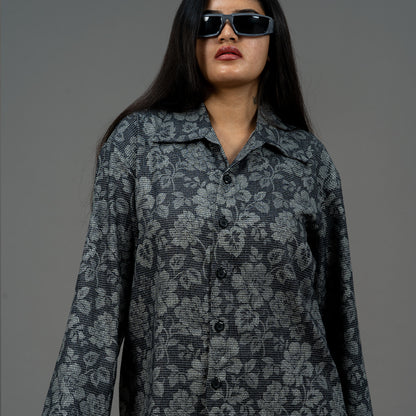 A model wearing our Charcoal Petal Shirt, showcasing the intricate floral prints against the charcoal background.