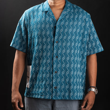 Model wearing blue wave Kantha shirt showcasing fit and intricate design.