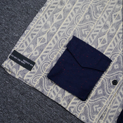 Close-up of Lurex Slate Shirt's blue pocket detail.