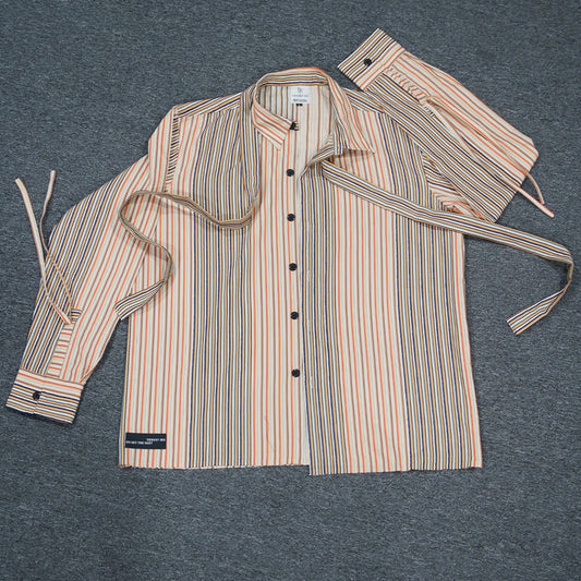 Flat lay view of the vibrant Stripey Blaze Shirt, showcasing its orange and white dobby stripe pattern and cross-body strap.