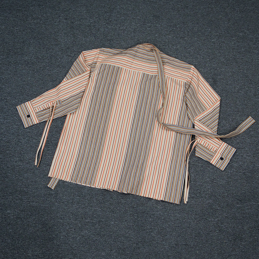 Flat lay of the back of the Stripey Blaze Shirt, highlighting its vibrant orange and white dobby stripe pattern.