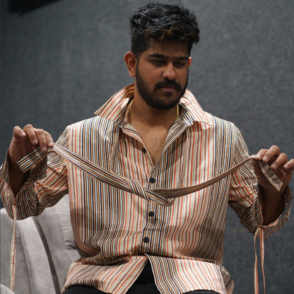 Model wearing the Stripey Blaze Shirt, showcasing its vibrant orange and white dobby stripe pattern and edgy sophistication.