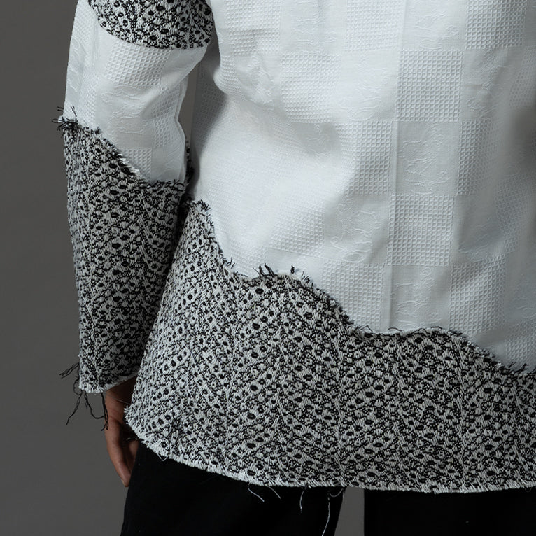 Close-up view of the back detail of the Slope Zip Jacquard Shirt, highlighting its intricate design and craftsmanship.